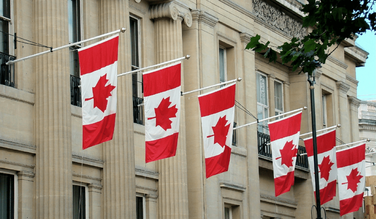 Canadian flag flies outside grey buildings representing the New SRO