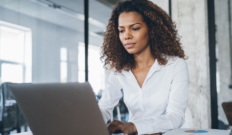 A senior manager looks at her laptop to find out about increased individual accountability