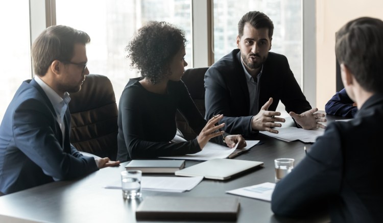 Compliance team members discuss self-disclosure to conform with the DOJ's new corporate enforcement and voluntary self-disclosure plan.