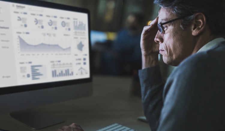 A compliance officer monitors suspicious transactions.