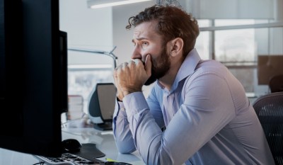 A man reviews recordkeeping policies to ensure compliance with FINRA.