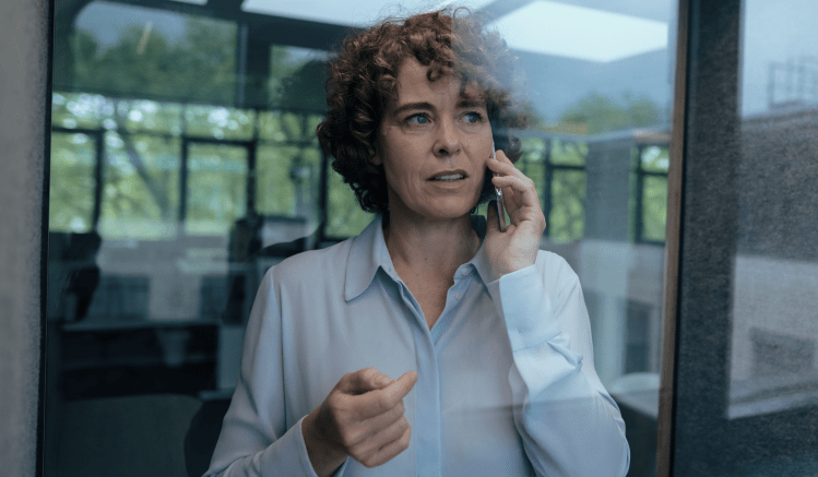 A compliance sales rep speaks on the phone to an external healthcare provider.