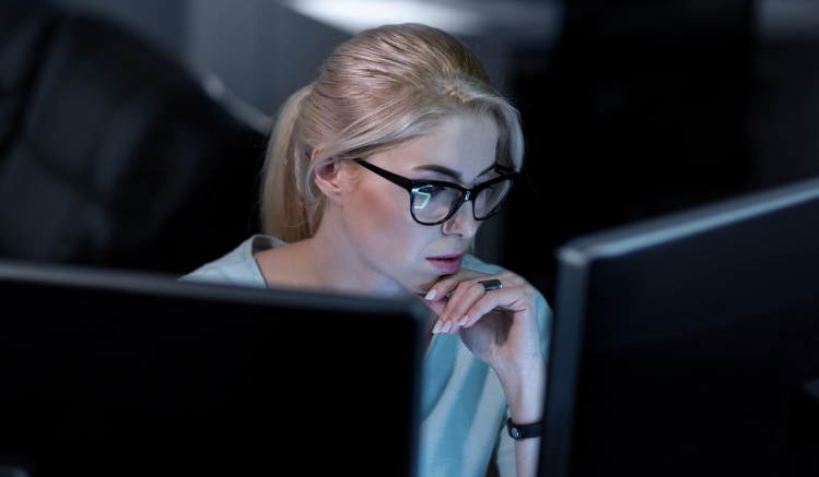A woman looks at a screen to understand recordkeeping rules in the Nordics
